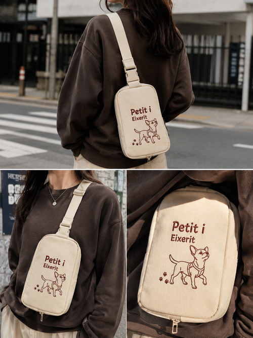 Ivory nylon crossbody sling bag with 'Petit i Eixerit' embroidery — Steve & Co. Explorer Sling Bag